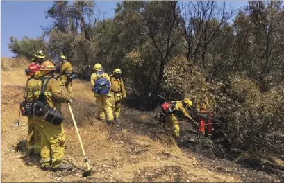  ?? THE IMPERIAL COUNTY FIRE DEPARTMENT
COURTESY OF ?? Firefighte­rs from several local department­s assigned to a strike team provided mutual assistance recently during the La Tuna and Missions fires in September. PHOTOS