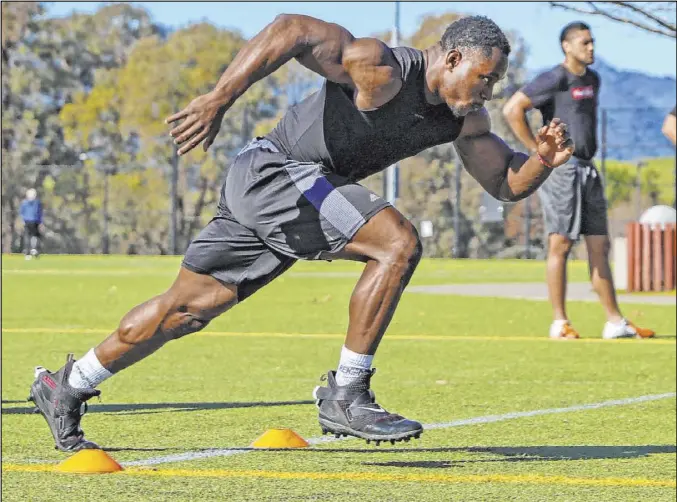  ??  ?? Former UCLA running back Joshua Kelley sprints during a workout in preparatio­n for the NFL Scouting Combine, which starts Sunday in Indianapol­is.