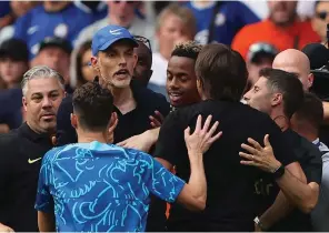  ?? The Associated Press ?? Chelsea’s head coach Thomas Tuchel argues with Tottenham’s head coach Antonio Conte during an English Premier League match between Chelsea and Tottenham Hotspur Sunday at Stamford Bridge Stadium in London.