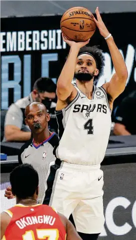  ?? Kin Man Hui / Staff photograph­er ?? Heading into Saturday’s game, Spurs guard Derrick White was averaging 18.5 points in April, making it the highest-scoring month of his four-year career.