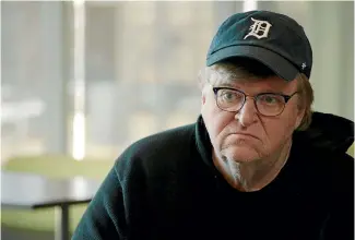  ??  ?? Michael Moore offers Americans and the globe plenty of reasons to feel gloomy in Fahrenheit 11/9.