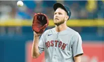  ?? CHRIS O’MEARA/AP ?? Red Sox starting pitcher Chris Sale reacts as he gets a new ball after giving up a three-run home run to Tampa Bay’s Randy Arozarena in a 9-7 loss to Tampa Bay. The Red Sox need Sale to rebound.