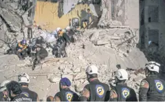  ?? EPA-EFE ?? Volunteers of White Helmets search for survivors after an explosion in the city of Idlib, Syria. The White Helmets are a Syrian Civil Defence volunteer organisati­on.