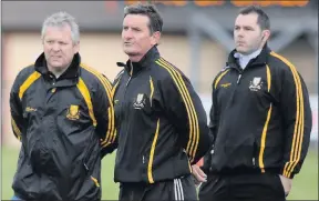  ?? Photo by Michelle Cooper Galvin ?? Dr Crokes manager Martin Byrnes (centre) with selectors Dave O'Connor and Finian Moran watching their side defeated in the County Championsh­ip for the first time since 2009 at at Rathbeg, Rathmore on Sunday.