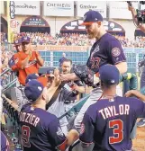  ?? MATT SLOCUM/ ASSOCIATED PRESS ?? Washington’s Stephen Strasburg, the MVP of the World Series, is congratula­ted after being taken out of the game in the ninth inning in Game 6 on Tuesday in Houston.