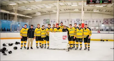  ?? SHANE PABON — FOR THE MORNING JOURNAL ?? Amherst poses after winning its third straight SWC tournament title Jan. 19with a 6-0win over Avon Lake at North Olmsted.