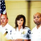  ?? MARIA ALEJANDRA CARDONA/MINNESOTA PUBLIC RADIO VIA AP ?? Minneapoli­s police chief Janee Harteau, center, stands with police inspector Michael Kjos, left, and assistant chief Medaria Arradondo during a news conference on Thursday in Minneapoli­s.