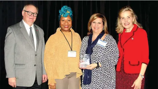  ?? Contribute­d photo ?? Main Street El Dorado is recognized for the Best Image/Branding Campaign in the 2020 Main Street Arkansas Excellence in Downtown Revitaliza­tion Awards. The ceremony was held last month during the 2020 Arkansas Municipal League Winter Conference in Little Rock. Pictured from left, are Stacy Hurst, secretary of the Arkansas Department of Parks Heritage and Tourism; El Dorado Mayor Veronica Smith-Creer; Beth Brumley, executive director of Main Street El Dorado; and Jimmy Bryant, director of the Division of Arkansas Heritage.