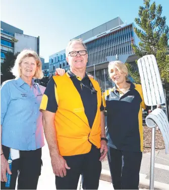  ?? Picture: JASON O'BRIEN ?? Gold Coast Health employees Lisa Hanson, John Beecher and Tina Northover.