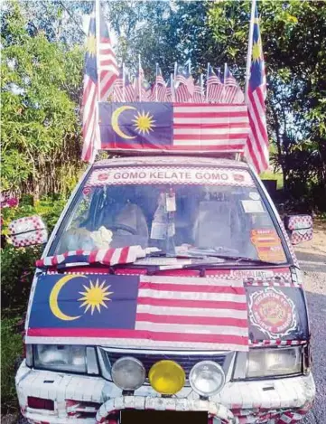  ??  ?? VAN Pak Do turut dihiasi bendera Malaysia.