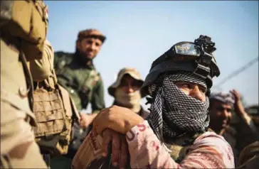  ?? ODD ANDERSEN/AFP ?? Soldiers from the Iraqi army 9th armoured division wait at base adjacent to the Al-Intissar neighbourh­ood of Mosul, on Monday.