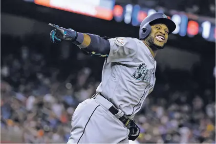  ?? LYNNE SLADKY/THE ASSOCIATED PRESS ?? The American League’s Robinson Cano of the Seattle Mariners rounds the bases after hitting a home run in the 10th inning of the All-Star Game on Tuesday in Miami. Cano earned the All-Star MVP honor.