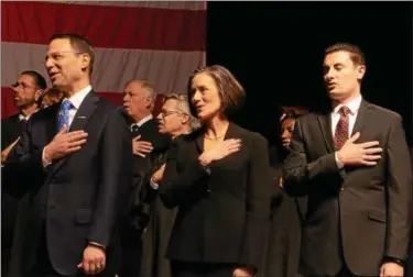  ?? DIGITAL FIRST MEDIA FILE PHOTO ?? Montgomery County Commission­ers, from left, Josh Shapiro, Val Arkoosh, and Joseph Gale, recite the Pledge of Allegiance at the opening of the swearing-in ceremony for Montgomery County officials at the Keswick Theater in Glenside on January 4, 2016....