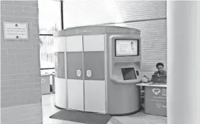  ?? PHIL GALEWITZ/KHN ?? A telemedici­ne kiosk is set up in the lobby of the Palm Beach County School District’s administra­tive building in West Palm Beach.