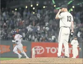  ?? ERIC RISBERG – THE ASSOCIATED PRESS ?? Giants reliever Will Smith stands on the mound after giving up a three-run home run to Houston’s Marwin Gonzalez, left, in the ninth inning of Monday’s game.