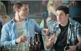  ?? Courtesy, Universal Pictures ?? Stifler, played by Seann William Scott, left, and Jim, played by Jason Biggs, do a few shots in American Reunion, the latest sequel to the R-rated raunchfest American Pie.