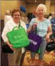  ?? PEG DEGRASSA – DIGITAL FIRST MEDIA ?? Mary Kate Jordan, left, of Media and Ellie Joyce, right, of Folsom hold up their “goodie bags” that they filled with incentives, giveaways and valuable informatio­n at the 2018 Senior Living Expo at Harrah’s Philadelph­ia in Chester on Friday.