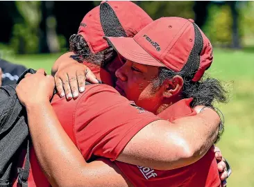  ??  ?? Canterbury golfer Olive Tapu (right) gets congratula­tions from manager Kate Turner after her win against Wellington at Waitikiri yesterday.