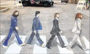  ?? CONTRIBUTE­D ?? The Chalk Guys — Hector Diaz and Ken Mullen — re-created The Beatles’ famous Abbey Road album cover two years ago at the Lake Worth Street Painting Festival.