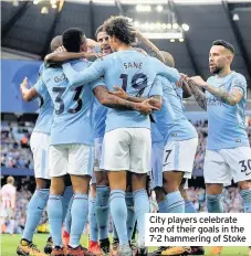  ??  ?? City players celebrate one of their goals in the 7-2 hammering of Stoke