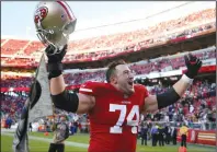  ?? NHAT V. MEYER/TRIBUNE NEWS SERVICE ?? San Francisco 49ers' Joe Staley (74) cheers as he leaves the field following a win in 2017 in Santa Clara.