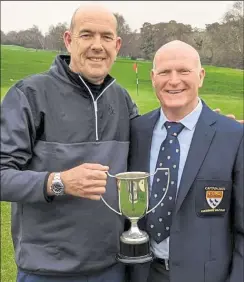  ?? ?? Simon Leggatt receives the Hallet Cup from Canterbury Golf Club captain Mark Broadhurst
