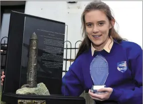  ?? Photo by Don MacMonagle ?? LEFT: Rebecca Lee, St Brigid’s Secondary School, with her prize, the Fr Pat Horgan trophy