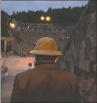  ??  ?? A man enters the ancient theater of Epidaurus to listen a solo concert by Kavakos.