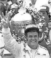  ?? AP ?? Al Unser waves three fingers in Victory Lane at Indianapol­is Motor Speedway after winning the 62nd Indianapol­is 500 in 1978. Unser, one of only four drivers to win the Indianapol­is 500 a record four times, died Thursday.
