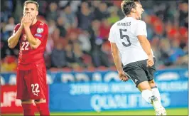  ??  ?? Germay's defender Mats Hummels celebrates scoring next to Czech Republic s midfielder Filip Novak during the FIFA World Cup 2018 qualificat­ion football match against Czech Republic in Plzen, Czech Republic