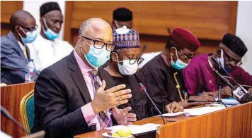  ??  ?? Director General, Nigeria Centre for Disease Control ( NCDC), Dr. Chikwe Ihekweazu ( left) explaining details of spending of funds for COVID- 19 response to the Public Accounts Committee of the House of Representa­tives in Abuja… yesterday.