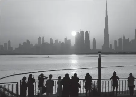  ??  ?? The Dubai skyline, including the Burj Khalifa at right: The UAE offers filmmakers a tax-free shooting environmen­t and Dubai’s futuristic, skyscraper-studded skyline — which might explain why the city is targeted in movies so often.