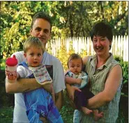  ?? ?? Darren and Kelley Goad hold their sons Joshua and Jacob. Both boys were diagnosed with autism before they were 2 years old.