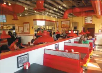  ?? PHOTOS BY DONNA ROVINS — DIGITAL FIRST MEDIA ?? Freddy’s Frozen Custard &amp; Steakburge­rs has opened its third area location, 221 Eagleview Blvd. in Uwchlan. The new restaurant, which features cooked-to-order-food, opened Tuesday, Dec. 11. This photo shows the inside of the restaurant.