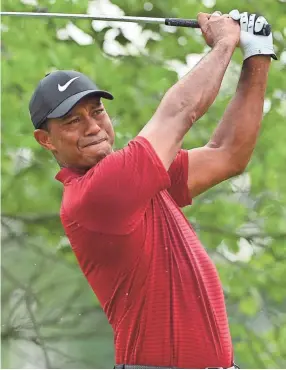  ??  ?? Tiger Woods hits his tee shot on the second hole during the final round of the PGA Championsh­ip on Sunday at Bellerive Country Club. Woods finished in second place, two strokes behind Brooks Koepka. JEFF CURRY/USA TODAY SPORTS