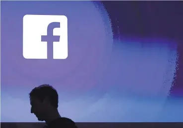  ?? MARCIO JOSE SANCHEZ/ASSOCIATED PRESS ?? Facebook CEO Mark Zuckerberg walks at the company’s headquarte­rs in Menlo Park, Calif.