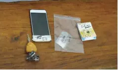  ?? CONTRIBUTE­D PHOTO ?? A plastic pack containing 5 grams of suspected shabu, cash, a cellphone, and a car key are among the items the police seized from suspected drug dealer Jonathan Lobriza during a buy-bust operation in Mandurriao, Iloilo City.