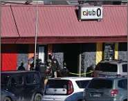  ?? (AP/The Denver Post/Helen H. Richardson) ?? Members of the Colorado Springs police department, the FBI and other agencies work Sunday at the scene of a deadly Saturday night shooting at Club Q in Colorado Springs, Colo.