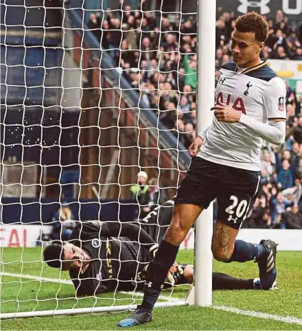  ??  ?? Tottenham’s Dele Alli scores against Millwall in their FA Cup quarter-final match on Sunday.