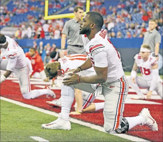  ?? DISPATCH] [BARBARA J. PERENIC/ ?? J.T. Barrett started the Big Ten championsh­ip game just six days after having surgery to remove loose cartilage from his right knee.