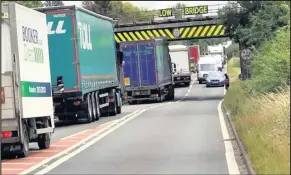  ??  ?? These images were posted on Facebook site Spotted Hinckley showing the lorry stuck under the bridge on the A5 on Friday.