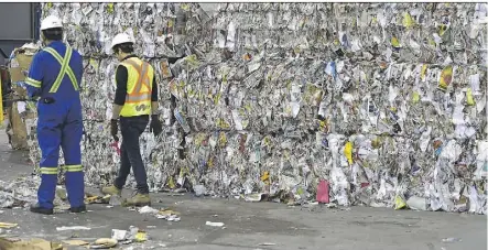  ?? ED KAISER ?? These bundles of recycled paper at the Edmonton Waste Management Centre are destined for China. One bundle was torn apart and checked for contaminat­ion by an inspector from China last Wednesday.