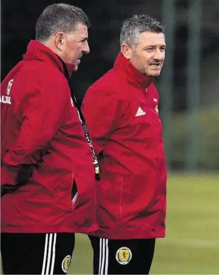  ??  ?? GAME PLAN: Scotland manager Gordon Strachan gives pointers to his assistants Mark McGhee, left, and Tony