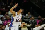  ?? The Associated Press ?? ■ Kansas forward Jalen Wilson celebrates after making a basket against Texas in the Big 12 Conference tournament Saturday in Kansas City, Mo.