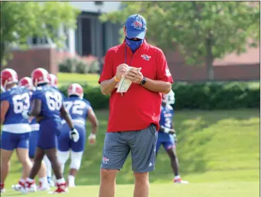  ?? Louisiana Tech Athletic Communicat­ions ?? Back to work: Louisiana Tech head coach Skip Holtz and the Bulldogs completed their sixth practice on Tuesday in Ruston, La. In a schedule change, Louisiana Tech will open its season against Baylor on Sept. 12.