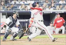  ??  ?? Washington Nationals’ Juan Soto watches his three-run home run in front of New York Yankees catcher Austin Romine during the fourth inning of a
baseball game on June 13, at Yankee Stadium in New York. (AP)