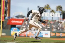  ??  ?? Giants outfielder LaMonte Wade Jr. doubled against Colorado in the fifth inning after being rushed into the lineup.