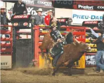  ?? PHOTOS BY ANDY WATSON ?? Sean Willingham rides Triplett Bucking Bulls’s Off The Rez during the first round of the Billings Built Ford Tough series.