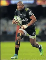  ?? Picture: GALLO IMAGES ?? IN COMPLETE CONTROL: Sharks’ Makazole Mapimpi shows his pace during the Super Rugby match against the Highlander­s at Kings Park Stadium in Durban on Saturday. The Sharks won 38-12