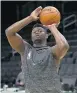  ?? WINSLOW TOWNSON/AP ?? The New Orleans Pelicans' Zion Williamson practices during a pre-game routine on Jan. 11.